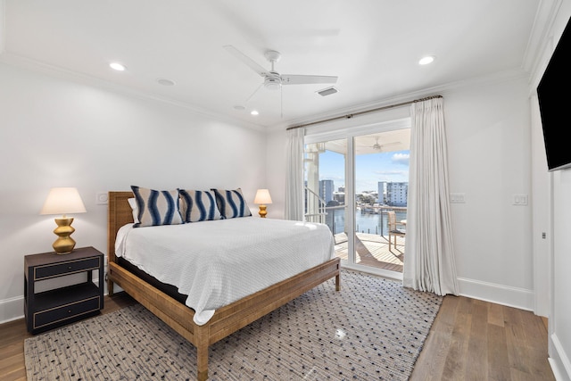 bedroom with ceiling fan, access to exterior, wood-type flooring, and ornamental molding