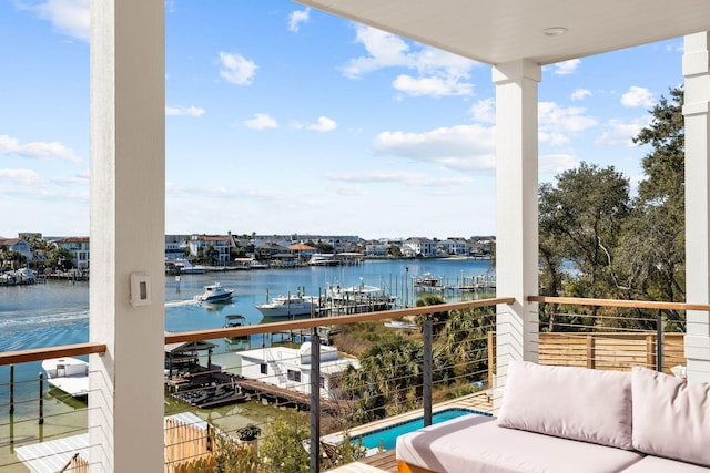 balcony featuring a water view