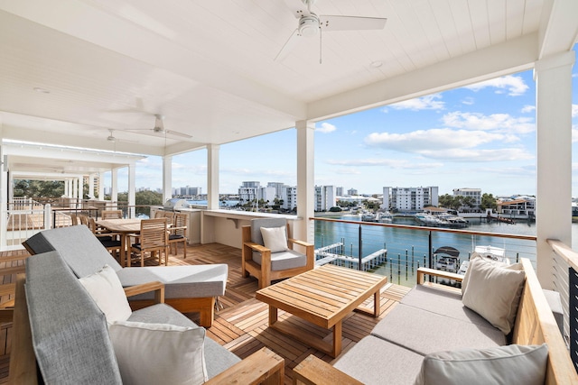 exterior space with a water view and ceiling fan