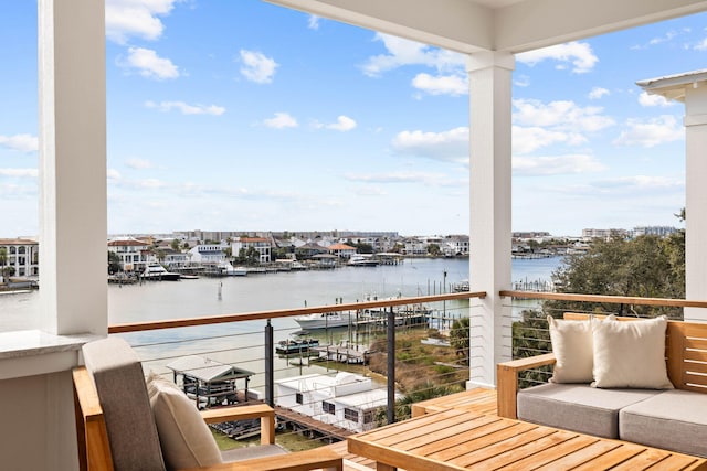 balcony featuring a water view