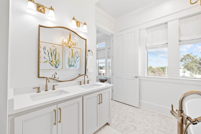 bathroom featuring vanity, crown molding, and a notable chandelier