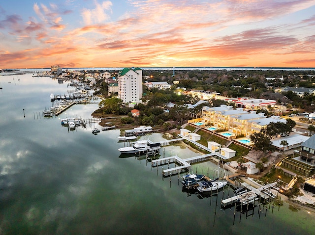 aerial view at dusk with a water view