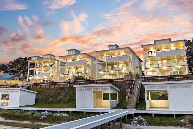 view of back house at dusk