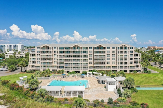 view of building exterior with a community pool