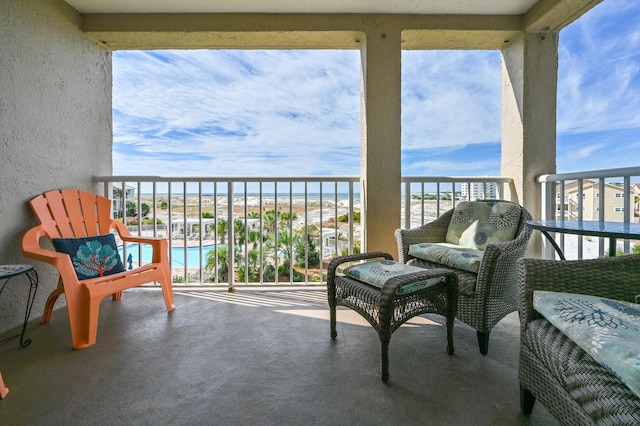 balcony featuring a water view