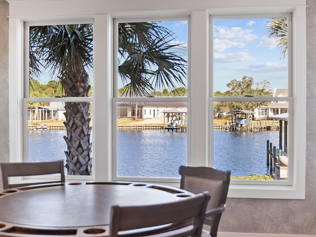 dining room featuring a water view