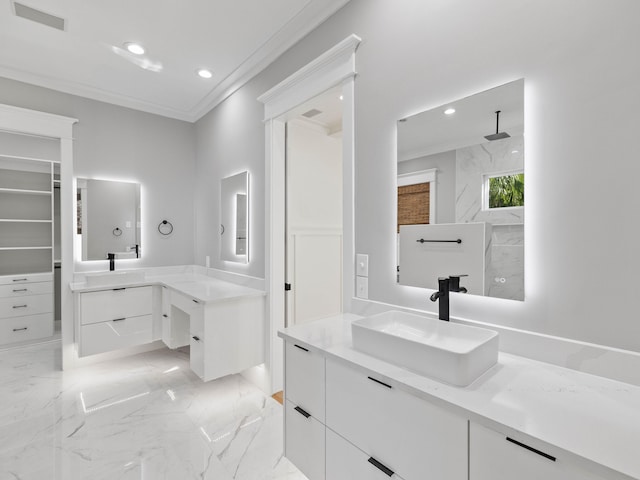 full bathroom featuring marble finish floor, crown molding, visible vents, and a sink