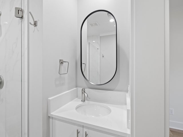 bathroom featuring a stall shower, visible vents, and vanity