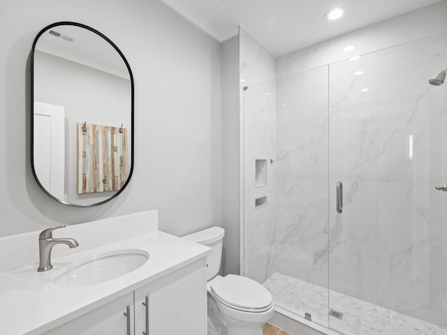 full bathroom with toilet, vanity, and a marble finish shower