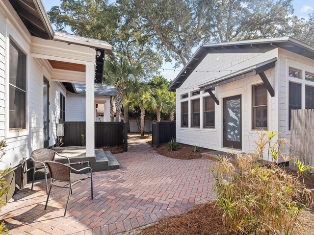 view of patio / terrace featuring fence