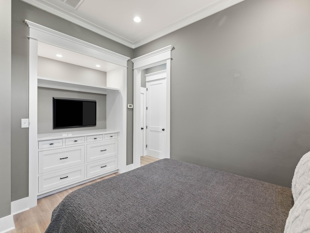 bedroom featuring light wood-type flooring and recessed lighting