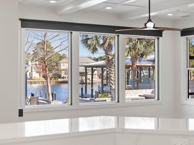 interior details featuring a water view, a ceiling fan, beam ceiling, and recessed lighting