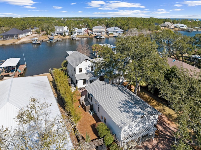 bird's eye view featuring a water view and a residential view