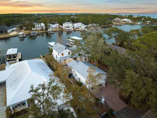 bird's eye view with a water view and a residential view