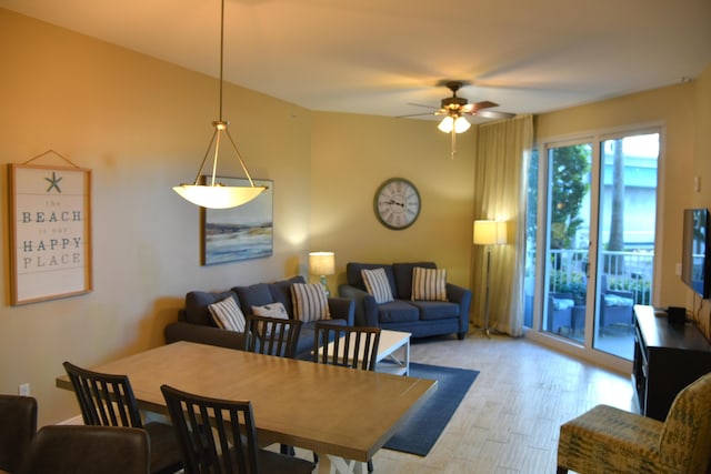 dining area with ceiling fan and light wood-type flooring