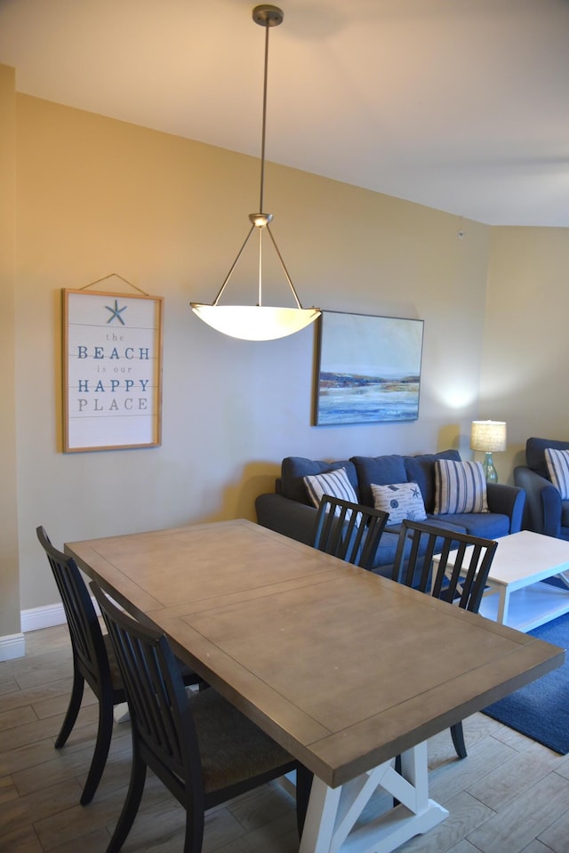 dining area with hardwood / wood-style flooring