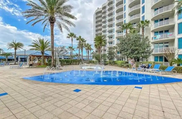 view of swimming pool featuring pool water feature