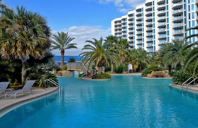 view of pool with a water view