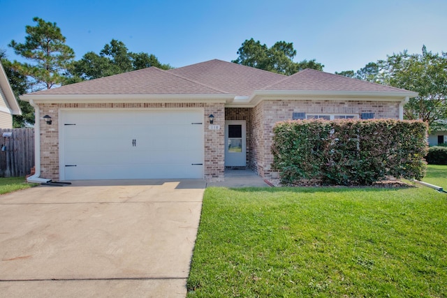 ranch-style house featuring a garage and a front yard