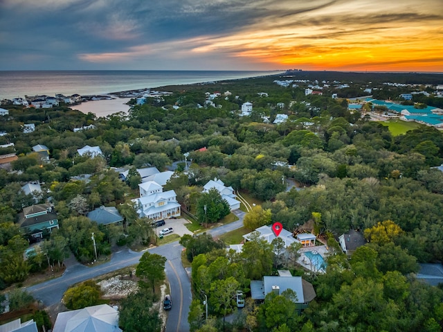 aerial view at dusk with a water view