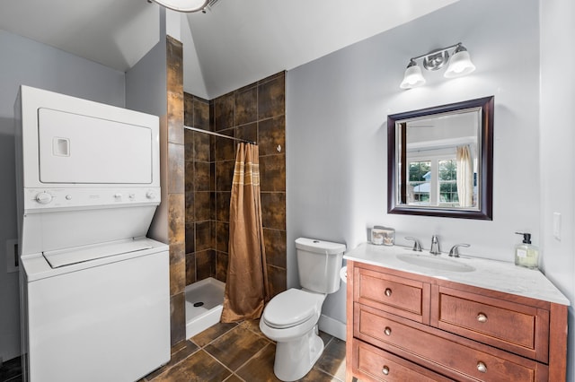 bathroom with stacked washer / drying machine, walk in shower, toilet, and vanity