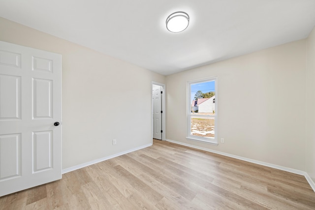 spare room with light hardwood / wood-style flooring