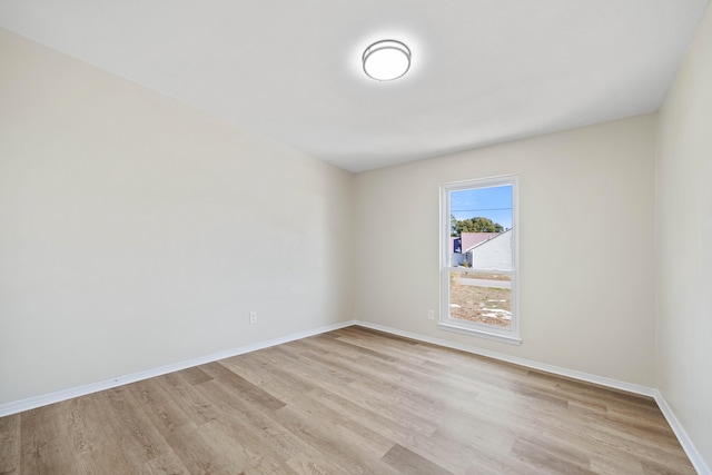 empty room with light hardwood / wood-style floors