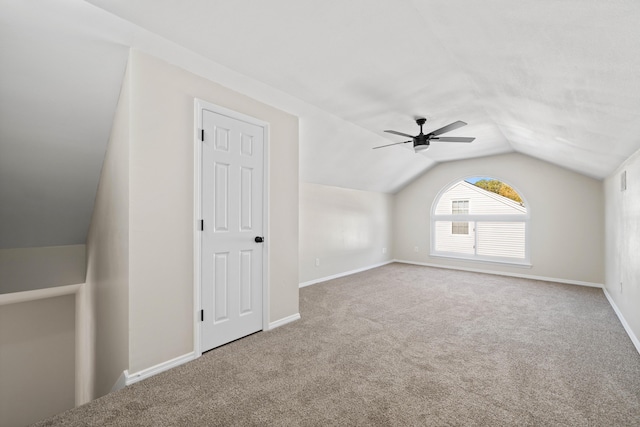 additional living space with vaulted ceiling and carpet floors