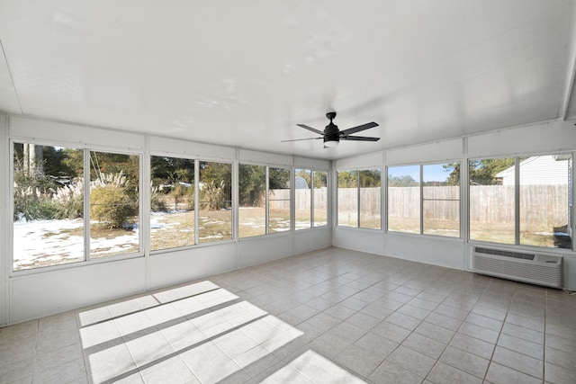 unfurnished sunroom with a healthy amount of sunlight and ceiling fan