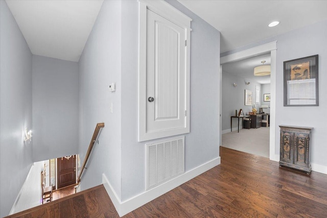 hallway with dark wood-type flooring