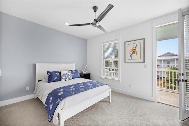 carpeted bedroom with ceiling fan and access to outside