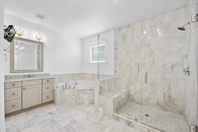 bathroom with vanity and independent shower and bath