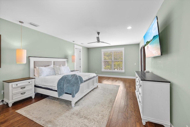 bedroom featuring dark hardwood / wood-style floors and ceiling fan