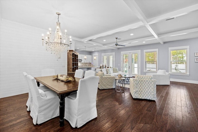 dining room with coffered ceiling, dark hardwood / wood-style floors, beamed ceiling, and an inviting chandelier