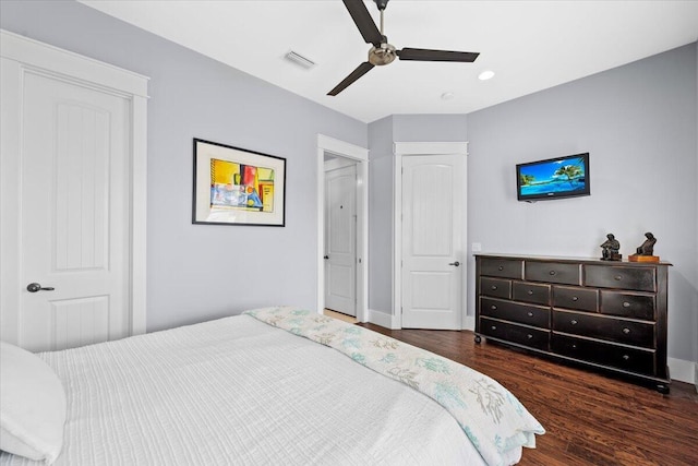 bedroom featuring dark hardwood / wood-style flooring and ceiling fan