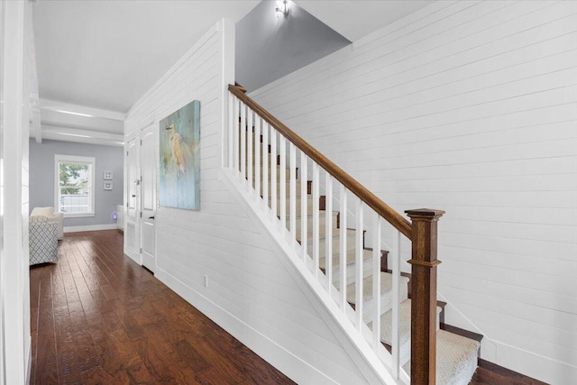 stairway with hardwood / wood-style floors