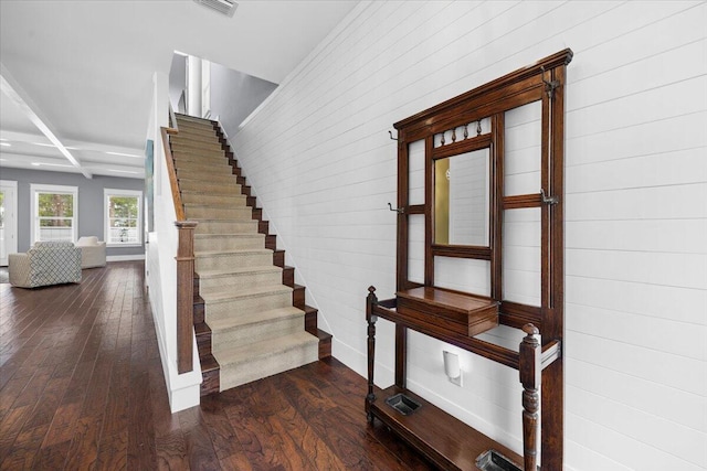 stairs featuring hardwood / wood-style flooring