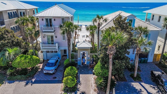 exterior space with a water view and a balcony