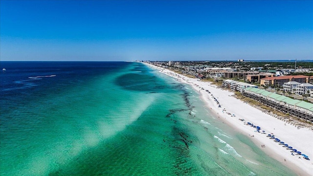 drone / aerial view with a water view and a view of the beach