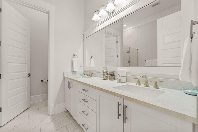 bathroom with vanity and a shower with door