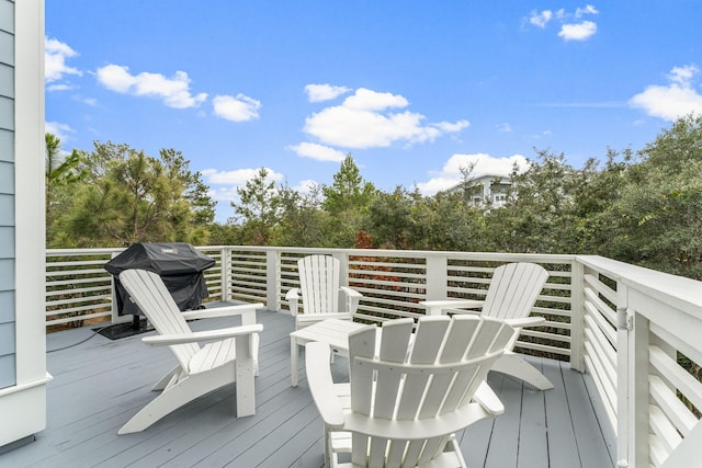 wooden terrace featuring area for grilling