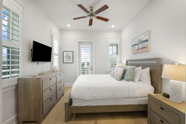 bedroom featuring ceiling fan, access to exterior, and light hardwood / wood-style flooring