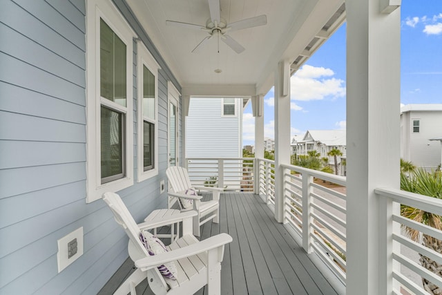 deck with ceiling fan and a porch