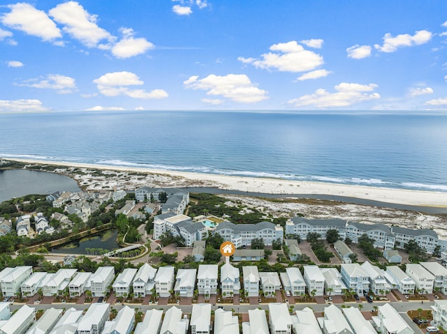 bird's eye view featuring a water view and a view of the beach