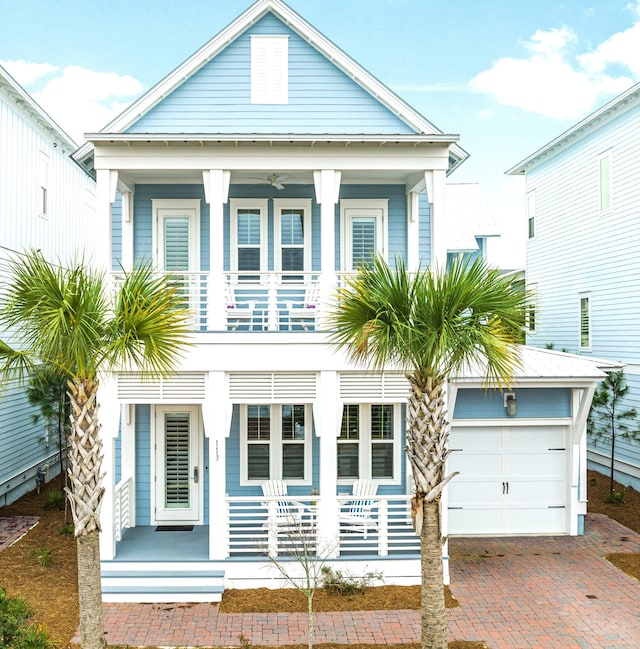 view of front of property featuring a garage and a porch