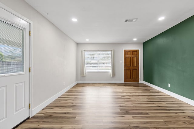 unfurnished room featuring hardwood / wood-style floors