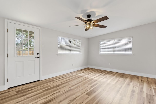 foyer featuring ceiling fan and light wood-type flooring