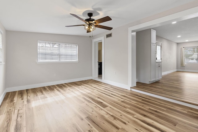 unfurnished room with light hardwood / wood-style flooring and ceiling fan