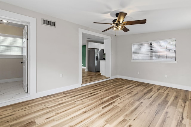 interior space featuring ceiling fan and light hardwood / wood-style flooring