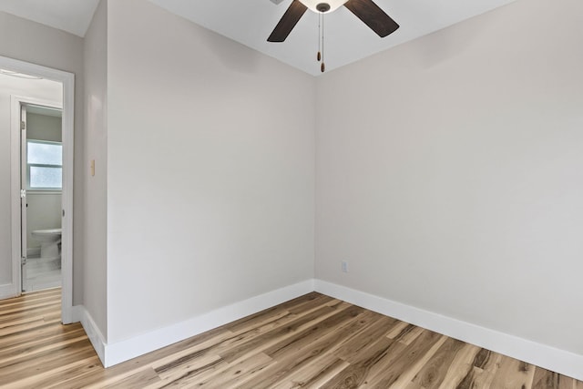 empty room with ceiling fan and light wood-type flooring